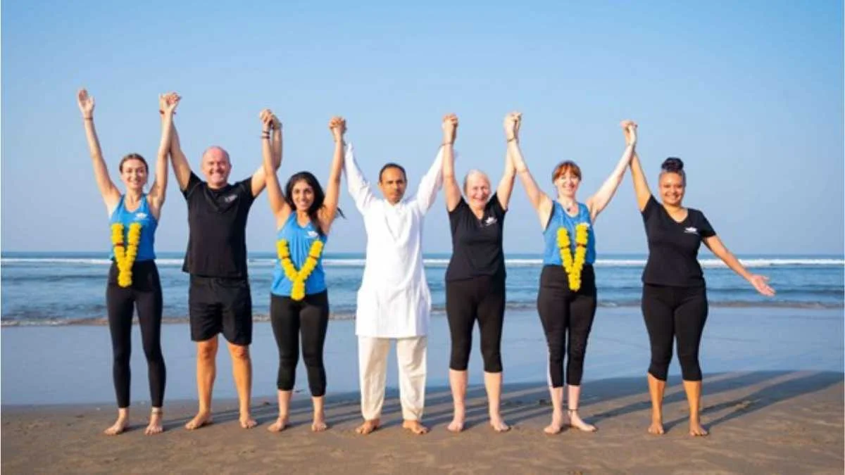 Himalaya Yoga Valley teaching faculty on the beach, representing trusted yoga certification paths in 2025